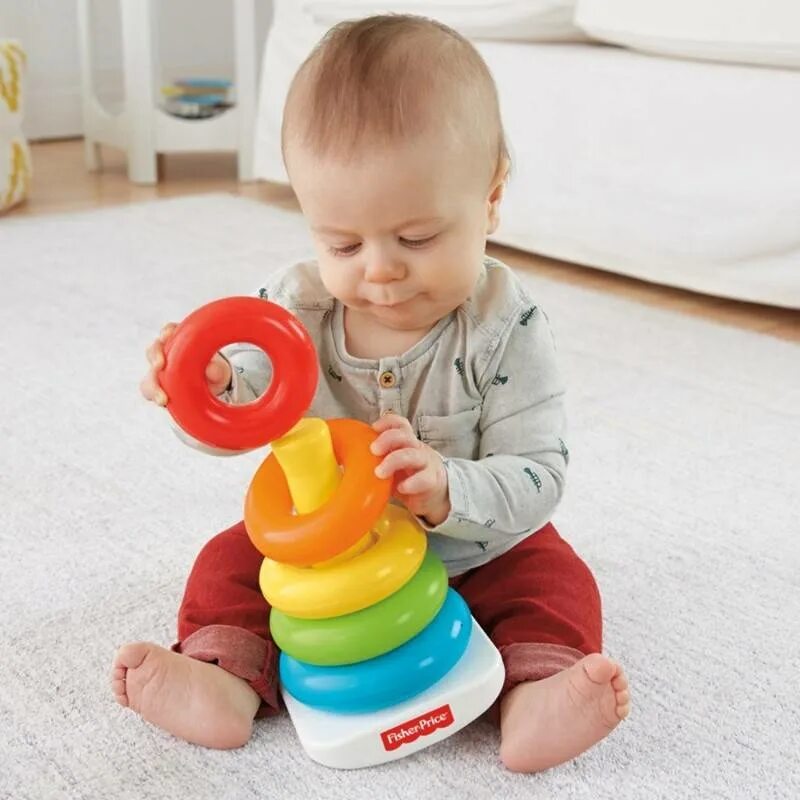 Какие игрушки нужны ребенку для развития. Пирамидка Fisher Price. Сортер Fisher-Price пирамидка. Fisher Price Pyramide. Игрушка пирамидка детская Fisher Price.