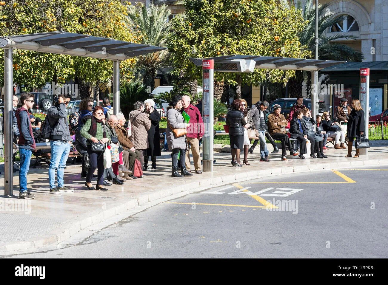 I was waiting the bus stop. Waiting bus. crowded bus.