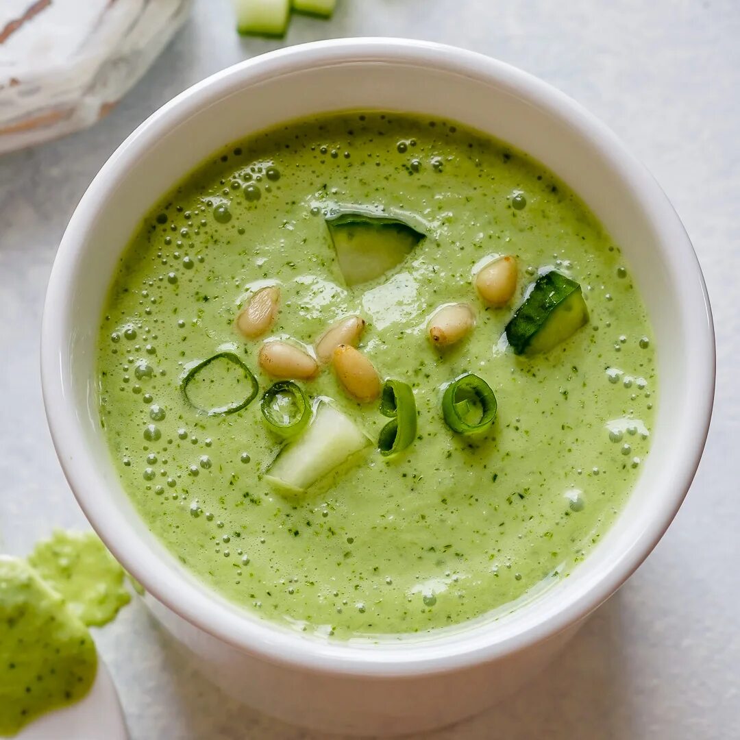 Why the soup. Cold cucumber soup. as cold as cucumber. chilled cucumber and microgreen soup with kefir in large glasses, close-up. chilled cucumber and microgreen soup with kefir in large glasses.