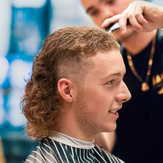 woman with mullet haircut / long mullet hair with shaved sides, earlocks and sho