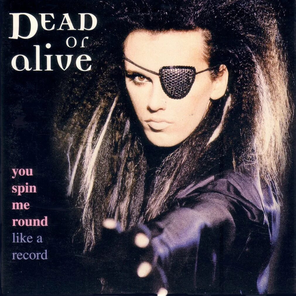 Песня around me. Dead or Alive пит Бернс. Pete Burns 1984. Dead or Alive группа. Пит бёрнс you Spin me Round.