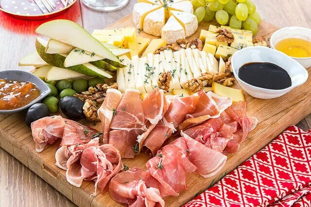 Charcuterie With Manchego Cheese And Serrano Ham On Baguette, Gouda + Aged Chedd