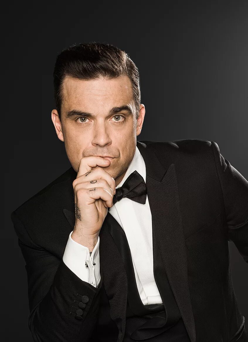 Исполнитель песен мужчина. Робби. Robbie Williams. Английский певец Робби Уильямс. Робби Уильямс певец фото.