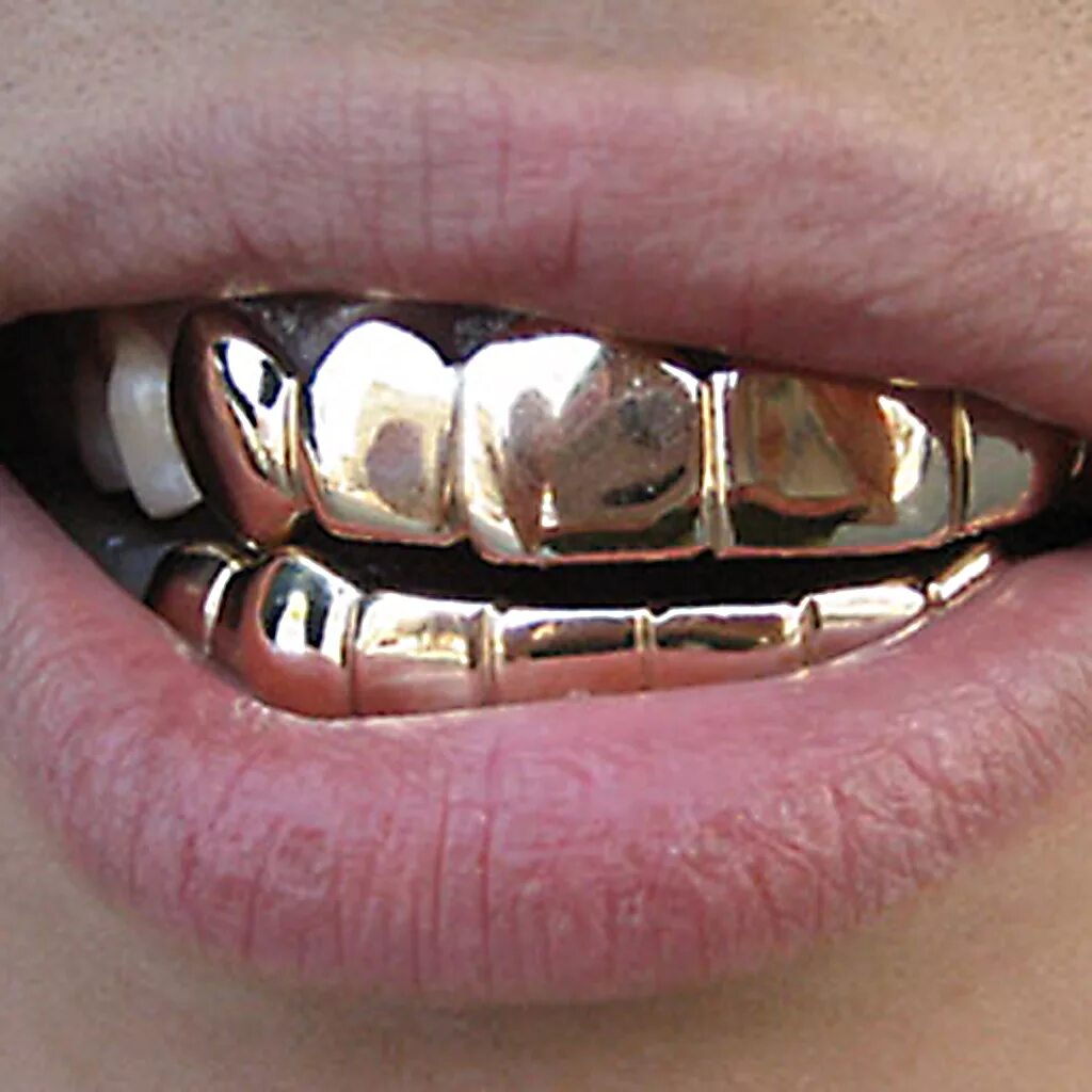 Грилзы букера. Металлическая коронка на зуб. Металческаяштампованная коронка. Штампованная коронка с напылением. Стальные зубы.