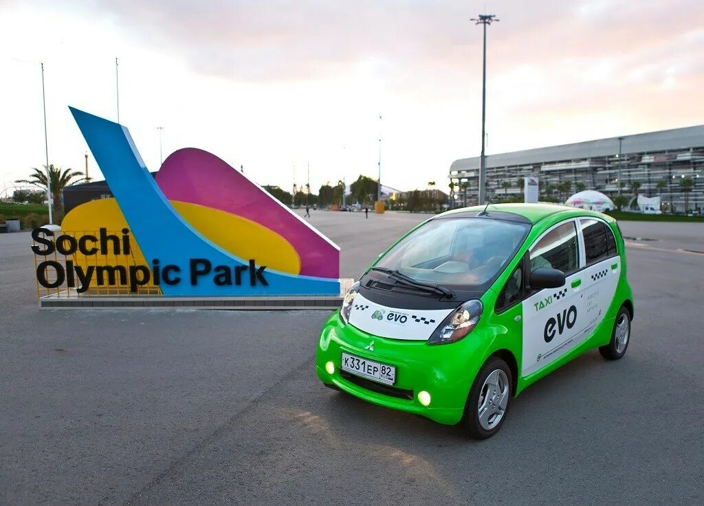 Электромобиль душанбе. Электромобиль Сочи Олимпийский парк. Mitsubishi i MIEV Taxi. Олимпийский парк Сочи электрокары. Электротакси Сочи.