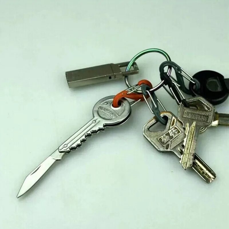 Мини без ключей. Нож брелок на ключи. Мини нож на ключи. Складной ножик на ключи. Брелок ножичек.
