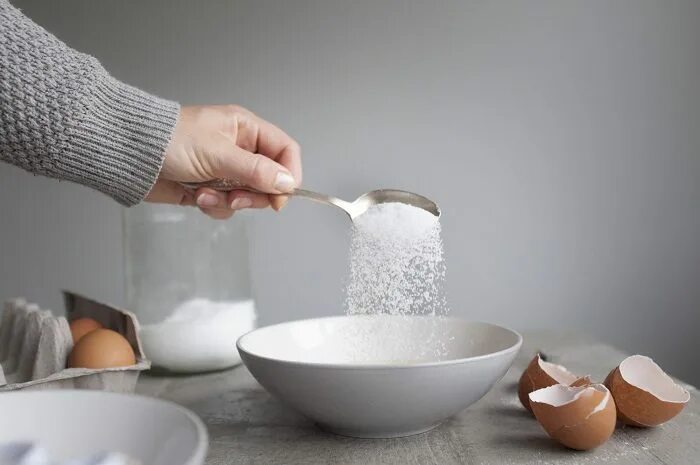 Add into. Add sugar. putting sugar in a bowl. putting sugar to flour. add into flour.