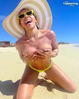 Tinashe Poses Topless on the Beach (5 Photos) .