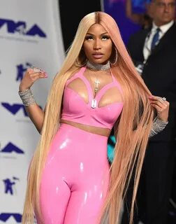Nicki Minaj in a pink latex outfit with camel toe.