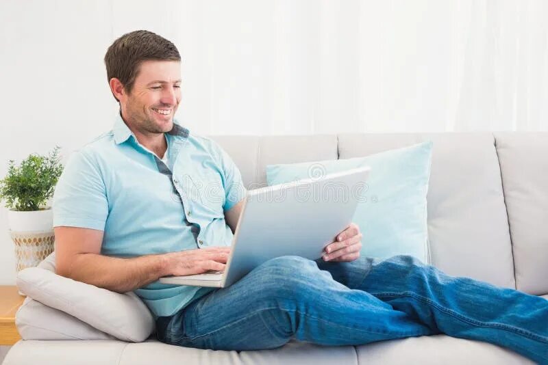Man Sleeping on Sofa with Laptop, Small Business People Concept Stock Photo - Im