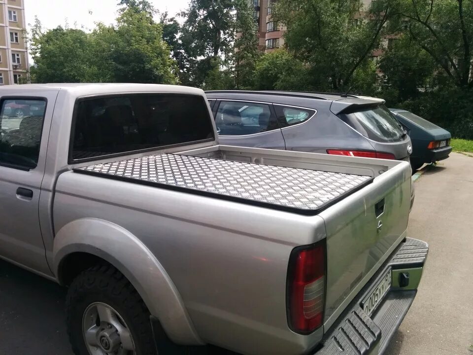 Nissan Patrol Pickup y61. Np300 кунг на кузов. Пикап Ниссан НП 300 В Америке. Задняя решетка на кузов НП 300.