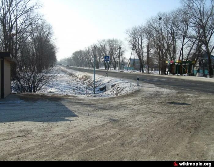 Гербы районов приморского края. Камень-рыболов герб. Памятники камень рыболова. Сайт камень рыболова. Камень-рыболов приморский достопримечательности.