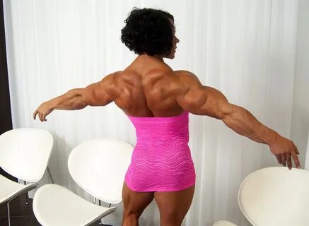 Massive female bodybuilder flexing her truly huge muscles.