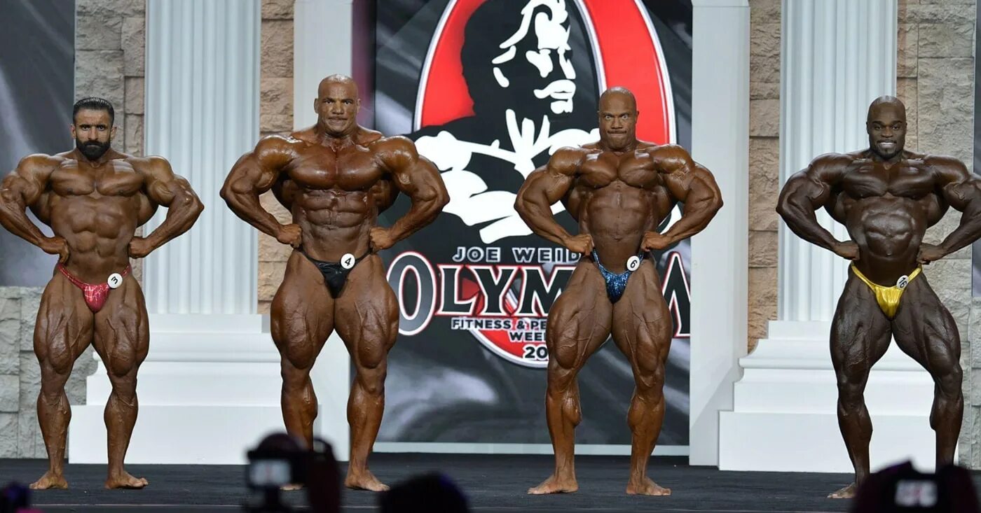 Бодибилдинг победители. Mr Olympia 2021. Мамду Элссбиай Мистер Олимпия 2021. Бодибилдер Мистер Олимпия 2021. Чемпион Мистер Олимпия 2021.