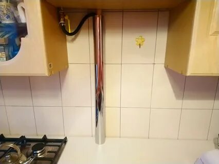 Как замаскировать трубу на кухне