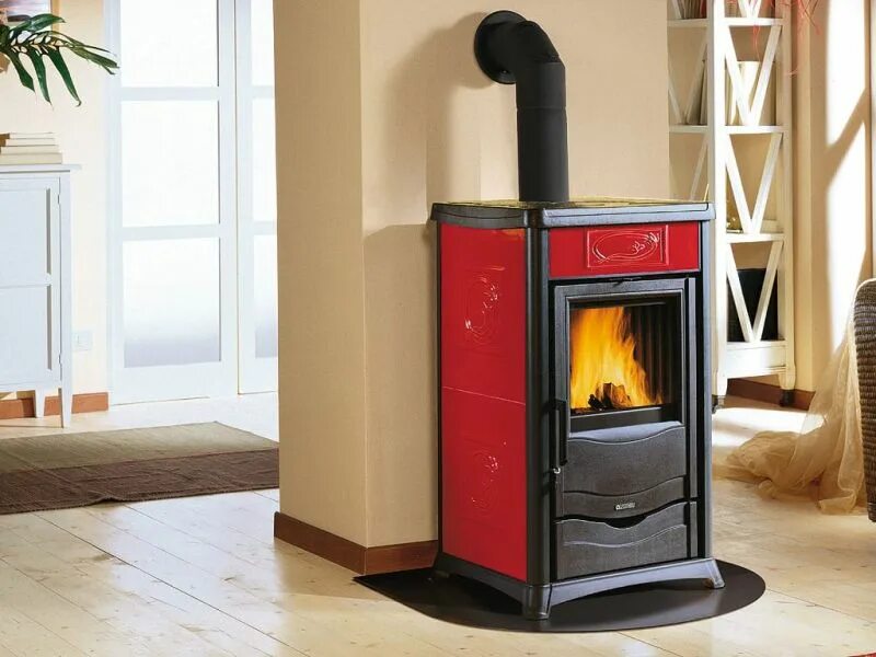 Дровяная печь-камин romotop belo 3s akkum металл. Отопительная печь камин. Печь камин la nordica junior. Отопительная печь камин. Печь-камин la nordica.