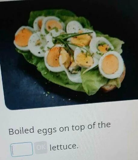 There some eggs on the table. Boiled eggs on top of the lettuce. lettuce перевод.