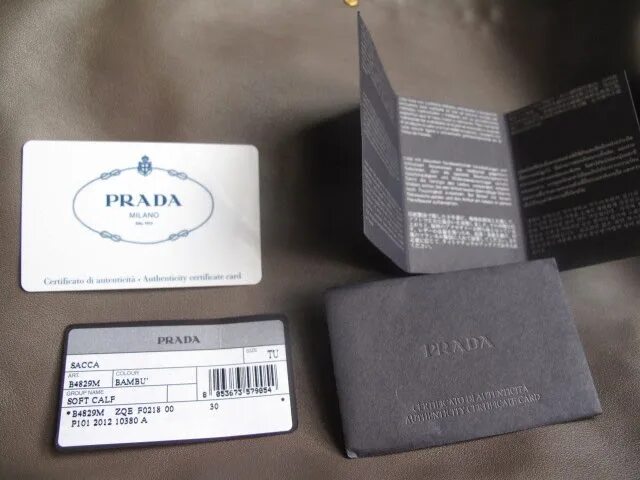 Как проверить marshall на оригинальность. Authentic Card Prada. Prada authenticity Card. Чек Прада. Prada карточка подлинности.