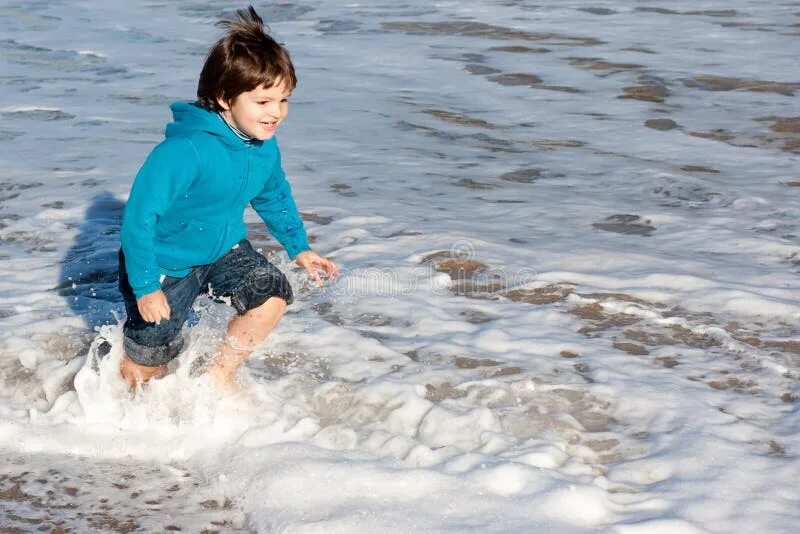 Kids getting wet clothes. My Kids get wet in clothes. Kid wet at Sea in clothes on.