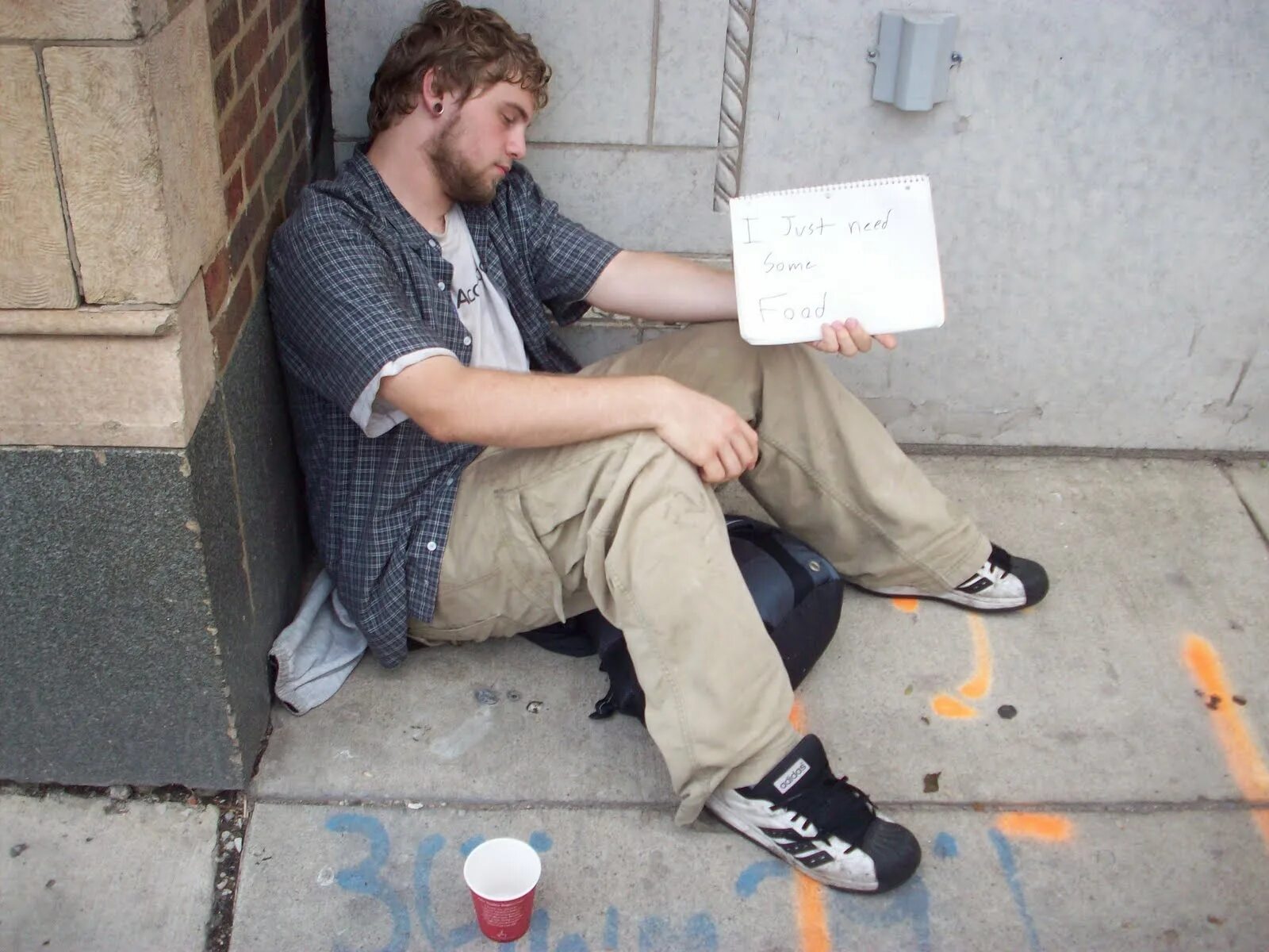 Homeless man. Young homeless man.