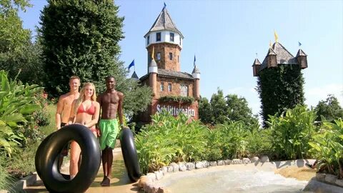 Schlitterbahn Waterpark showing a water park as well as a small group of pe...