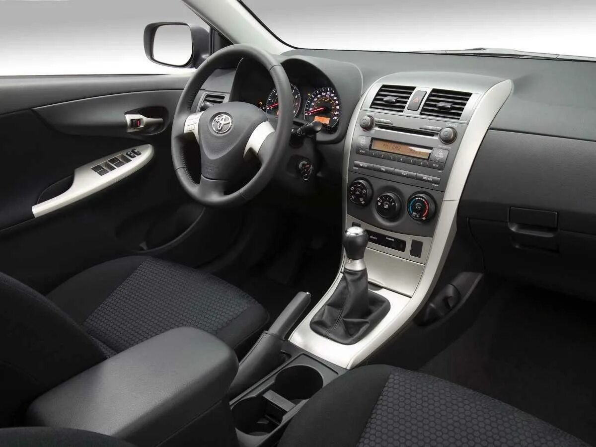 Тойота автомат или механика. Toyota Corolla 2008 салон. Toyota Corolla 2008 Interior. Toyota Corolla 2010 салон. Тойота Королла 2008 салон.