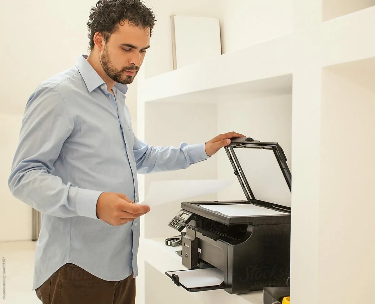 Print using. Мужчина и принтер белый фон. мужчина покупает принтер. printer in office above. businessman with office technics notebook printer.