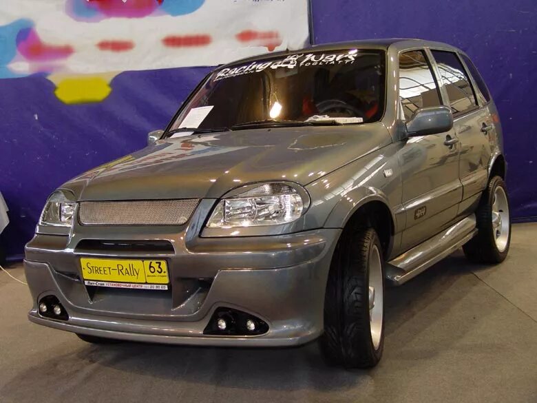 Тюнинг шевроле нива купить. Нива Шевроле обвес 2004. Chevrolet Niva Tuning. Тюнинговая Нива Шевроле. Chevrolet Niva 2008 в обвесе.