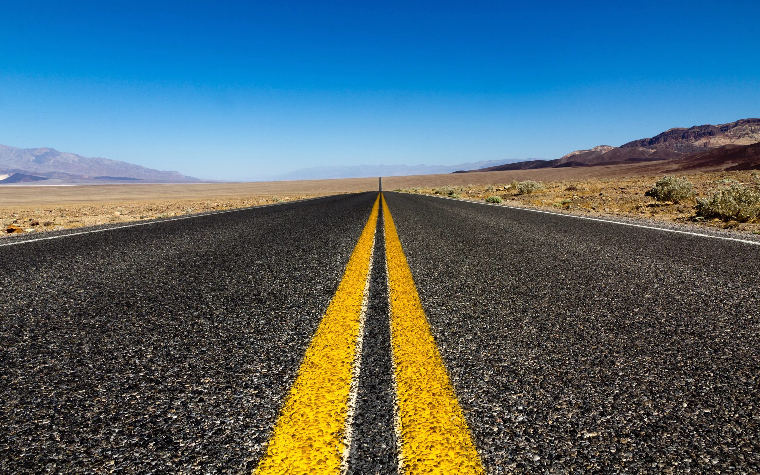 According to him the roads. Фон дорога. Асфальт. Дорога с желтой полосой. Дорога асфальт.
