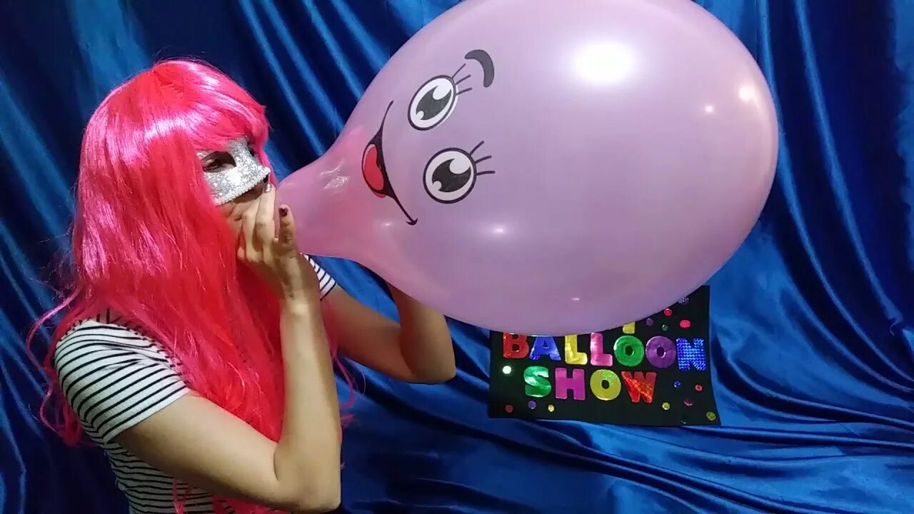 Balloon blowing up. Balloon pop. balloon pop girl. balloon blow to pop. to pop a balloon.