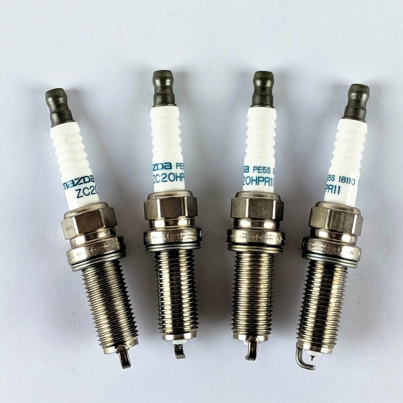 Оригинальные свечи мазда. Свечи mazda pe5s18110 zc20hpr11. mazda pe5s-18-110. pe5s-18-110. свечи зажигания для мазда сх-5 2.5.