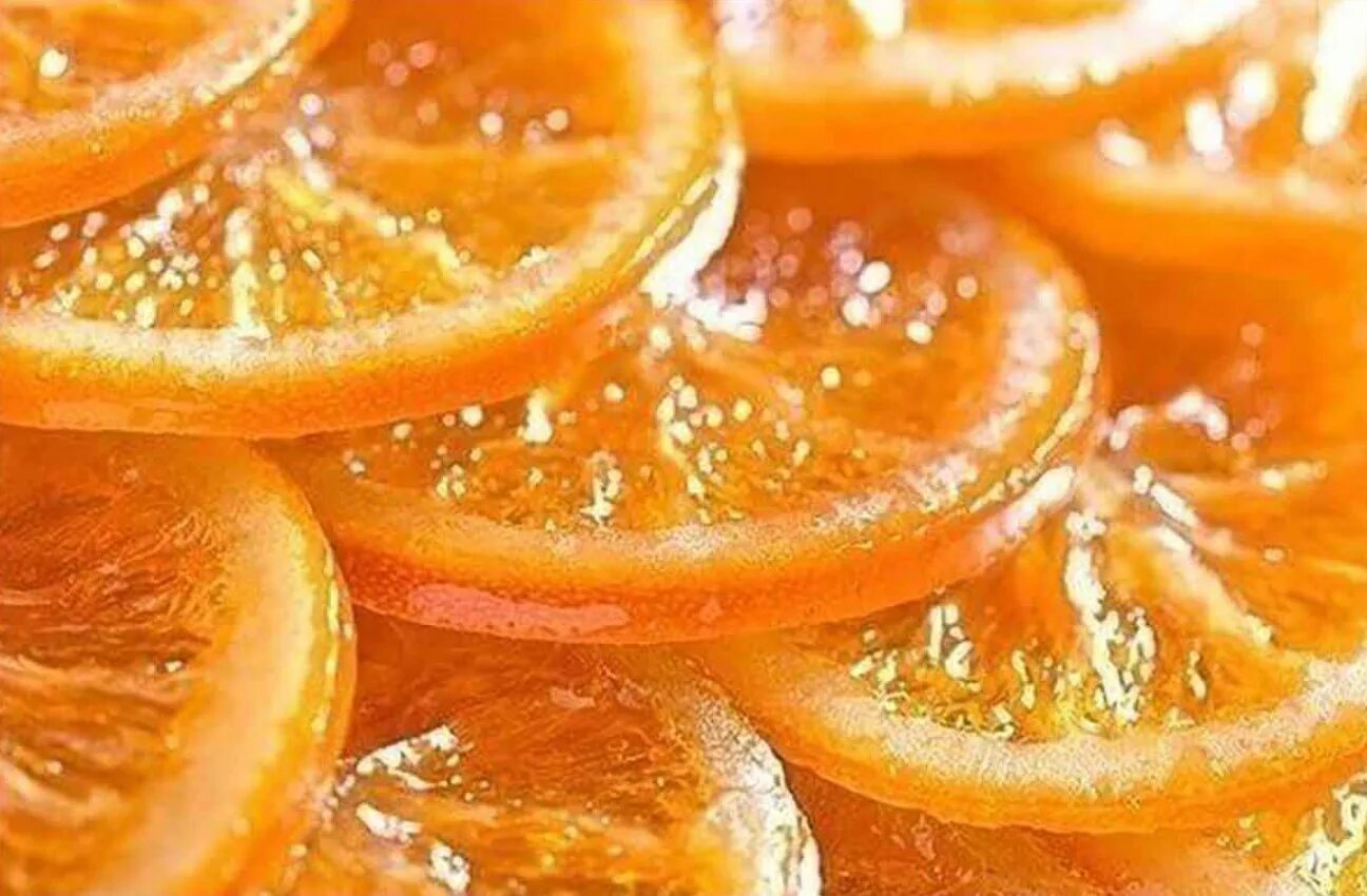 Апельсин повышает сахар. Карамелизированные дольки апельсина. Засахаренные дольки апельсина. Цукаты цитрусовые. Цукаты апельсиновые дольки.