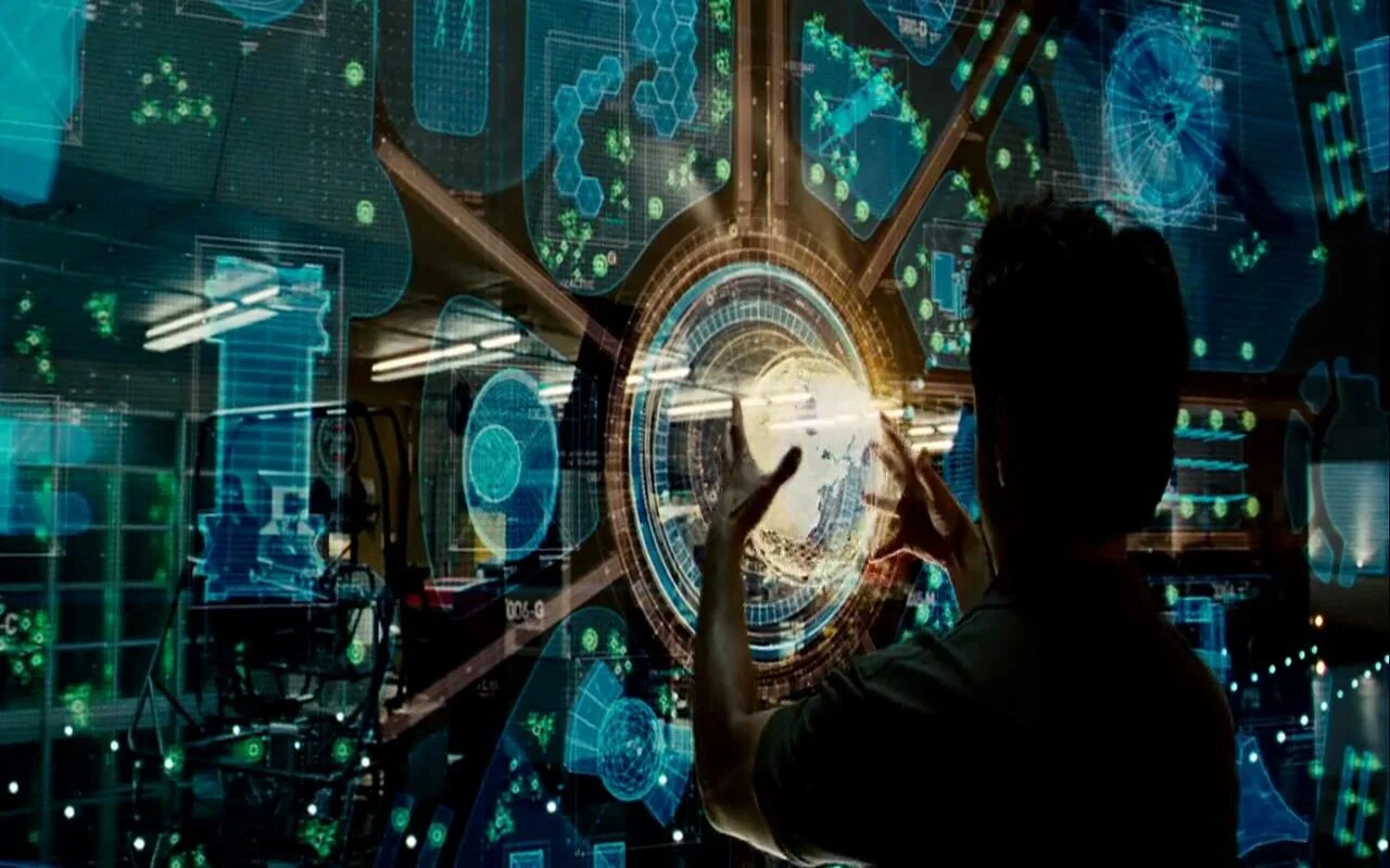 Рабочих часов в 2025 году. Тони Старк технологии голограмма. Тони Старк и Джарвис. Лаборатория Тони Старка. Тони Старк искусственный интеллект.