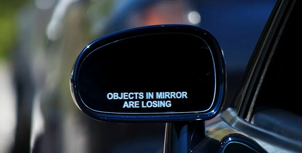 Is there a mirror in the. Object in the mirror are losing наклейка. objects in mirror.