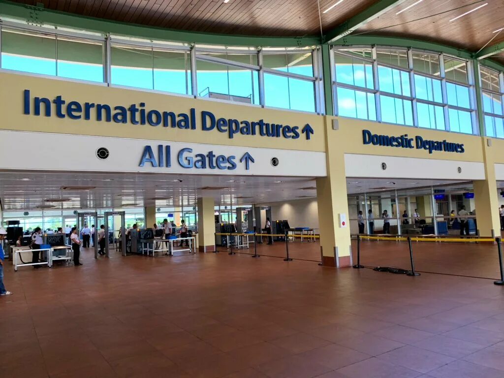 Международный аэропорт телефон. Аэропорт Тагбиларан Филиппины. International departures. Departure Gate. Departure Gate в аэропорту.