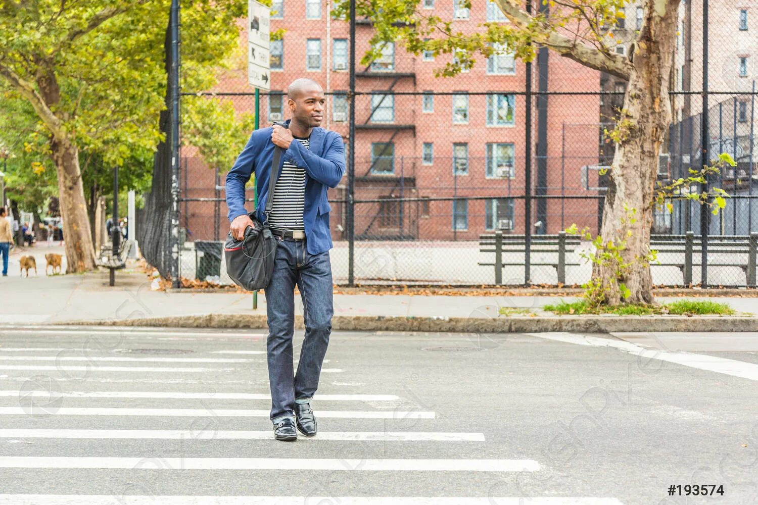 Man walk in the street. Люди идут по улице. Man crossing broadway. Мужчина идет по улице. Люди идут по улице.