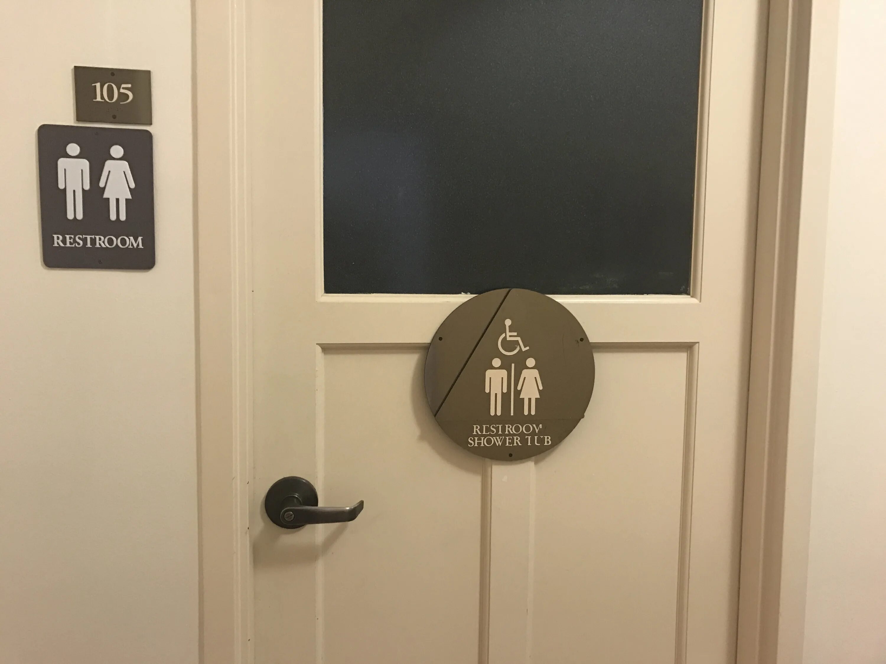 Screaming in public restrooms prank sound. Public restroom entrance wall fire alarm.