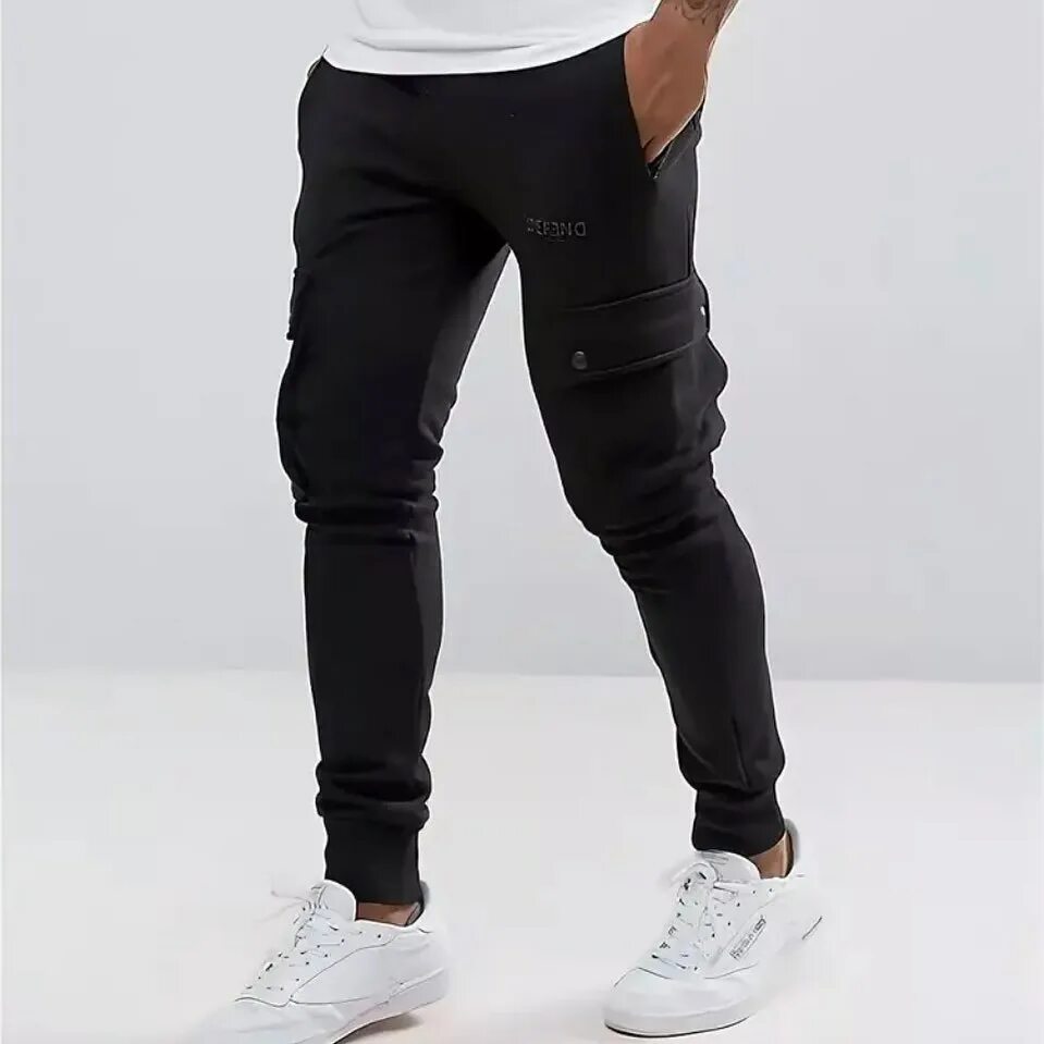 Спортмастер джоггеры. Джоггеры мужские Superdry. Джоггеры мужские Лондон. Джоггеры чёрные с карманами. Трикотажные джоггеры скинни.