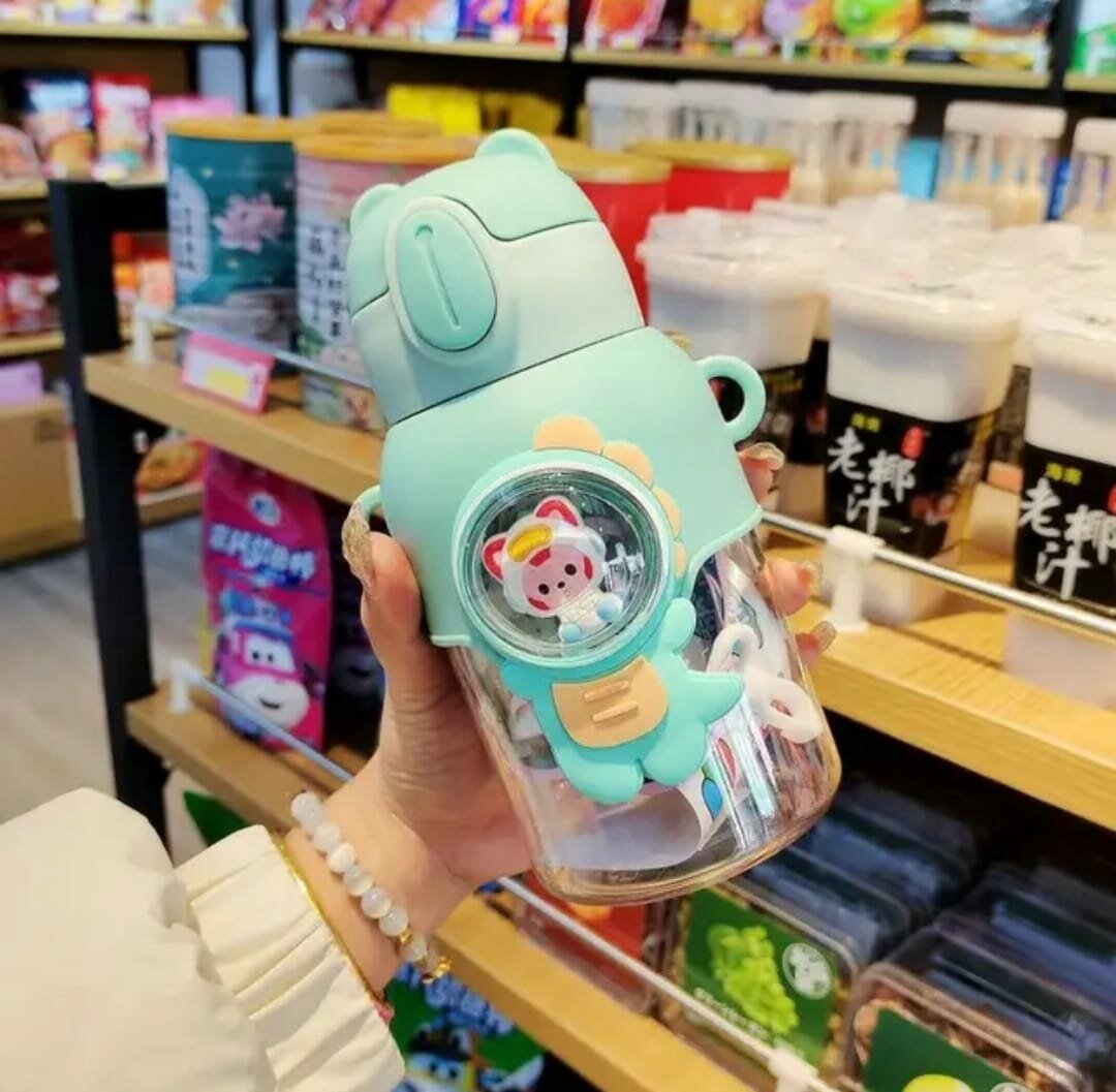 Bouteille avec astronaute vert clair