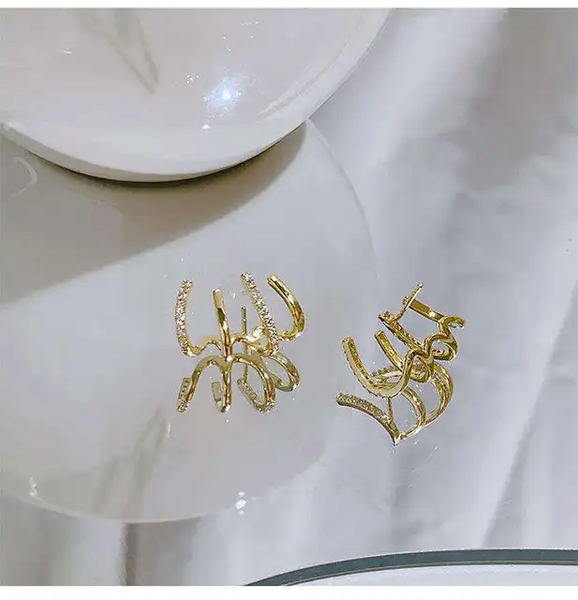 Boucle d'oreille en forme de triton
