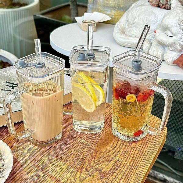 Glass cup with straw