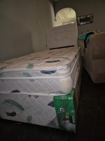 Single bed with headboard