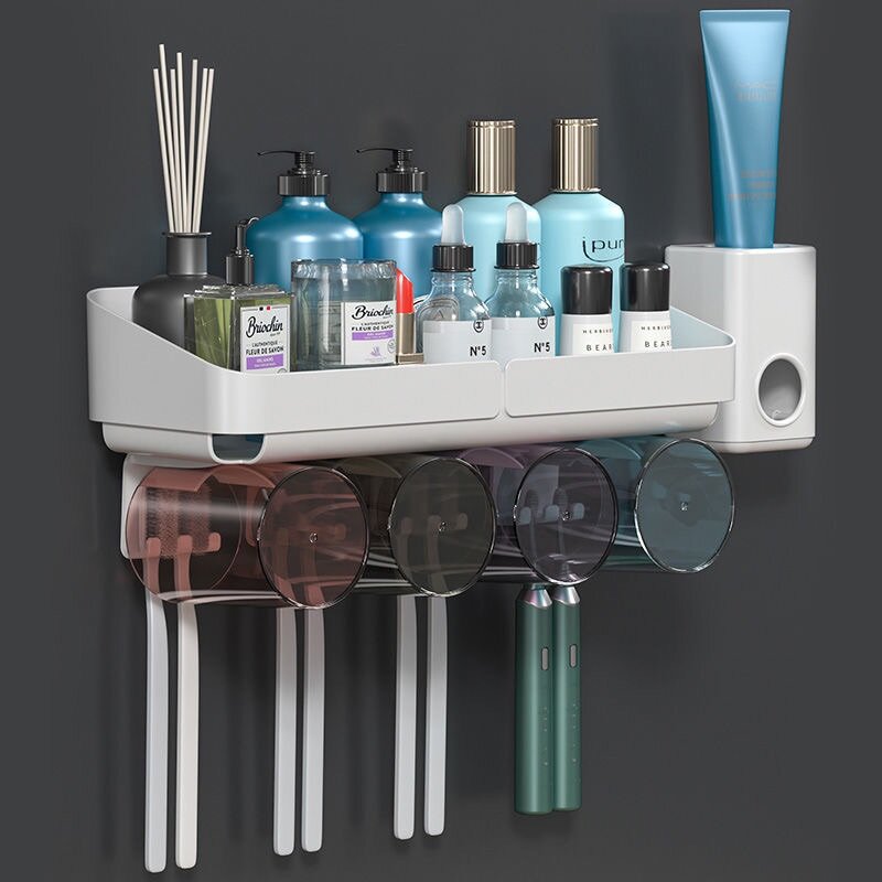 Toothpaste dispenser/toothbrush holder with cups