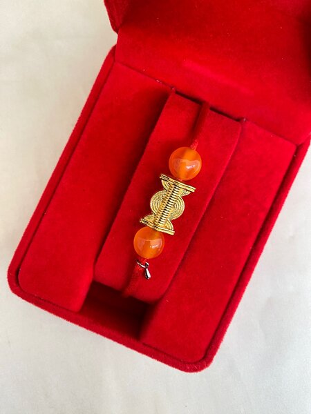 Bracelet avec poids baoulé