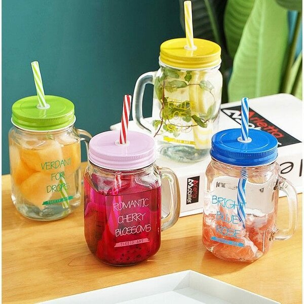 Glass bottle with straw