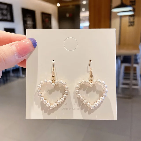 Boucle d'oreille en forme de cœur perlé
