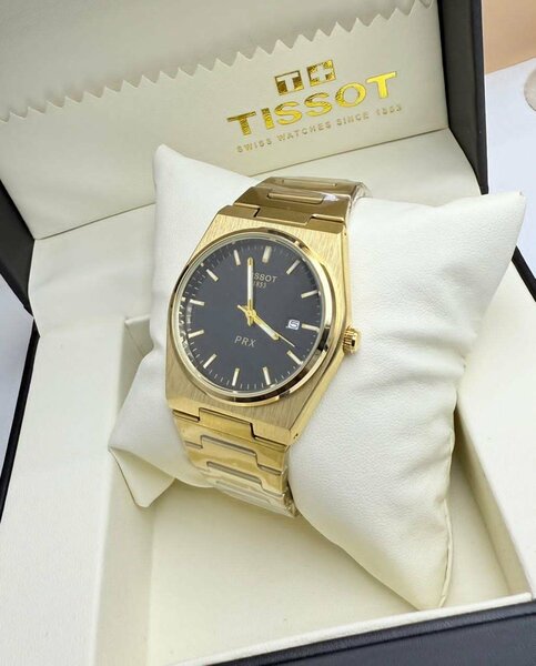 Montre Tissot PRX dorée