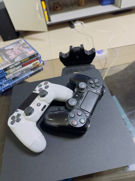 PlayStation 4 with 12 games including 2 original pads