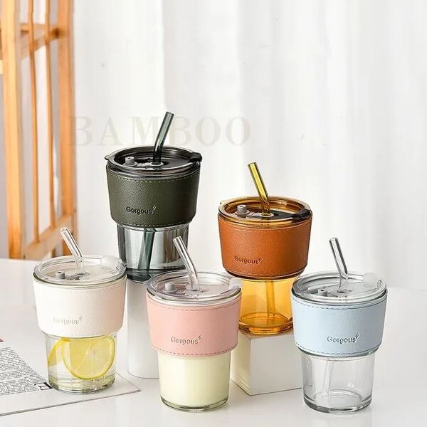 Glass cup with straw