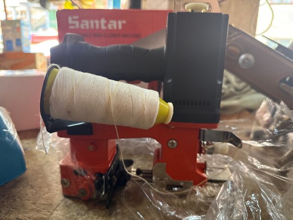 Portable sack sewing machine